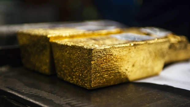 Gold bullion bars sit following casting at the Rand Refinery Ltd. plant in Germiston, South Africa, on Wednesday, Aug. 16. 2017. Established by the Chamber of Mines of South Africa in 1920, Rand Refinery is the largest integrated single-site precious metals refining and smelting complex in the world, according to their website. 