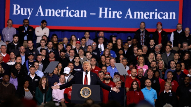 YPSILANTI, MI- MARCH 15: U.S. President Donald Trump speaks to auto workers at the American Center for Mobility March 15, 2017 in Ypsilanti, Michigan. Trump discussed his priorities of improving conditions to bolster the manufacturing industry and reduce the outsourcing of American jobs. (Photo by Bill Pugliano/Getty Images)
