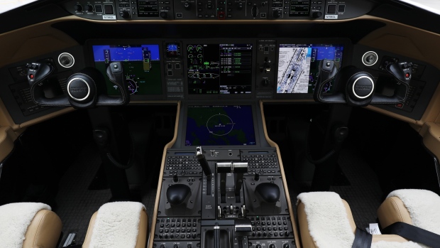The cockpit of a Bombardier Inc. Global 6000 business jet is seen during the Singapore Airshow held at the Changi Exhibition Centre in Singapore, on Tuesday, Feb. 6, 2018. Corporate-jet makers are flooding the market, spurring deep discounts for new aircraft and fueling a three-year slide in prices of used planes. 
