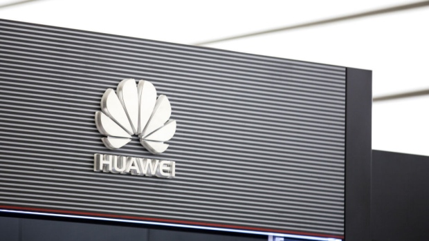 The Huawei Technologies Co. logo is displayed in an exhibition hall at the company's headquarters in Shenzhen, China, on Tuesday, June 5, 2018. Facebook Inc. said it had data-sharing partnerships with four Chinese consumer-device makers, including Huawei, escalating concerns that the social network has consistently failed to tell users how their personal information flows beyond Facebook. 