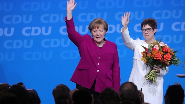 Annegret Kramp-Karrenbauer, right, with Angela Merkel. 