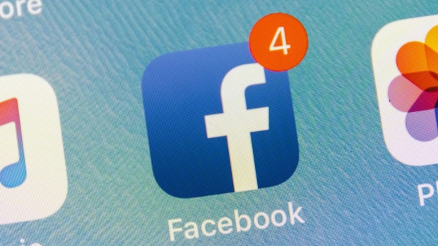 The Facebook Inc. application icon is displayed on an Apple Inc. iPhone in an arranged photograph taken in New York, U.S., on Thursday, July 26, 2018