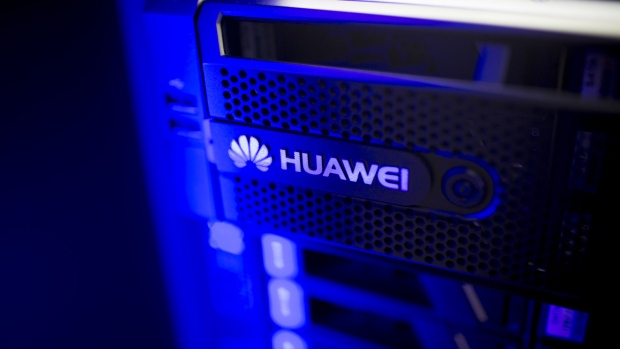 The Huawei Technologies Co. logo is displayed on a storage system inside an exhibition hall at the company's campus in the Longgang district of Shenzhen, China, on Wednesday, Aug. 6, 2014. 
