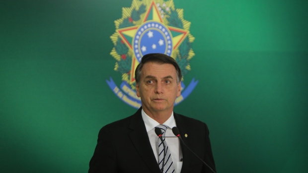 Jair Bolsonaro, Brazil's president-elect, speaks during a press conference in Brasilia, Brazil, on Wednesday, Nov. 7, 2018. President Michel Temer said he was willing to collaborate intensively with the transition, and asked the president-elect Bolsonaro to tell him which are the projects underway in Congress that he's interested in approving. "We will make every effort to approve them," Temer told reporters. Photographer: Andre Coelho/Bloomberg 