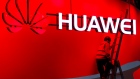 Laborers make final preparations to the Huawei Technologies Co Ltd. stand ahead of the Mobile World Congress (MWC) in Barcelona, Spain, on Saturday, Feb. 25, 2017. A theme this year at the industry's annual get-together, which runs through March 2, is the Internet of Things 