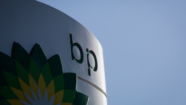 A BP Plc logo sits on a totem sign outside a gas station operated by BP Plc in London, U.K., on Tuesday, Feb 2., 2016. BP Plc reported a 91 percent decline in fourth-quarter earnings after average crude oil prices dropped to the lowest in more than a decade. The company's shares fell the most since August. 