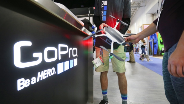 An vendor shows an attendee a GoPro Inc. Karma Quadcopter drone during the Outdoor Retailer (OR) Summer Market Show in Salt Lake City, Utah, U.S., on Saturday, July 29, 2017. Bloomberg is schedule to release consumer comfort figures on August 3. 