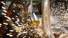 An employee welds together a frame for a sports utility vehicle (SUV) during production at the General Motors Co. (GM) assembly plant in Arlington, Texas, U.S. 