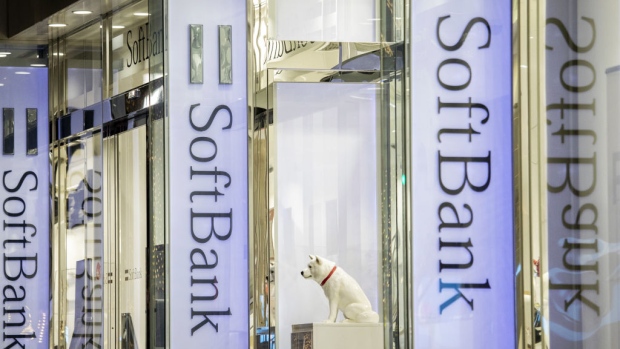 Signage for SoftBank Group Corp. is displayed outside a store in Tokyo, Japan, on Thursday, Nov. 29, 2018. SoftBank's 2.4 trillion yen ($21 billion) initial public offering of its Japanese telecommunications unit has successfully secured sales for the bulk of its shares to individual investors, people familiar with the matter said. 