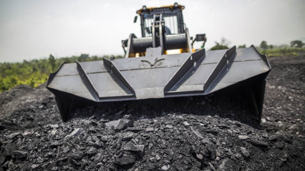 A front loader moves coal in Jharkhand, India. 
