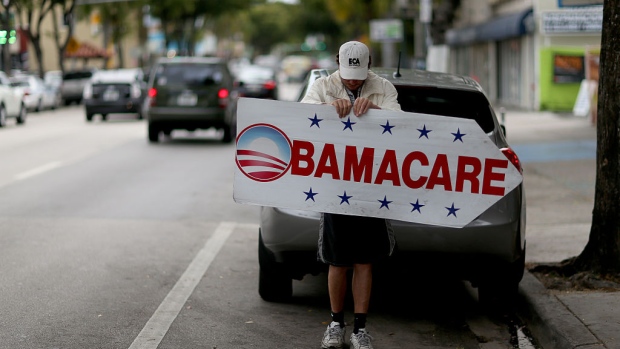 MIAMI, FL - FEBRUARY 05: Pedro Rojas holds a sign directing people to an insurance company where they can sign up for the Affordable Care Act, also known as Obamacare, before the February 15th deadline on February 5, 2015 in Miami, Florida. Numbers released by the government show that the Miami-Fort Lauderdale-West Palm Beach metropolitan area has signed up 637,514 consumers so far since open enrollment began on Nov. 15, which is more than twice as many as the next large metropolitan area, Atlanta, Georgia. (Photo by Joe Raedle/Getty Images) 