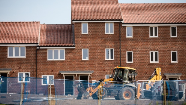 A digger stands outside residential properties at the Oaklands Hamlet housing development in the Barking and Dagenham borough of London, U.K. on Monday, Sept. 3, 2018. Jitters surrounding London's property market are finally starting to show up in home prices. 