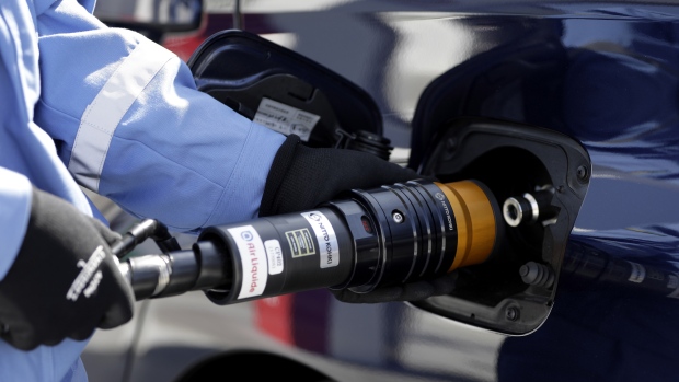 An employee inserts the nozzle of a hydrogen pump into a Toyota Motor Corp. Mirai fuel-cell vehicle (FCV) during a demonstration at the Kawasaki Hydrogen Station, operated by Air Liquide Japan Ltd., in Kawasaki, Kanagawa Prefecture, Japan, on Friday, March 30, 2018. The station is located adjacent to Air Liquide’s Kawasaki Oxyton production site between Tokyo and Kanagawa. 