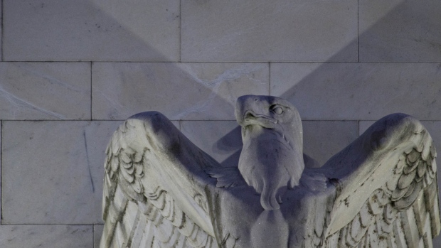 An eagle sculpture stands on the facade of the Marriner S. Eccles Federal Reserve building in Washington, D.C., U.S. 