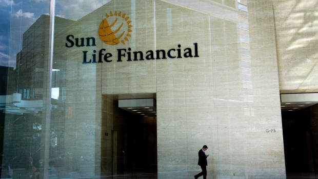 A man walks inside of the Sun Life Financial Inc. office on Bay Street in Toronto, Ontario, Aug. 29,