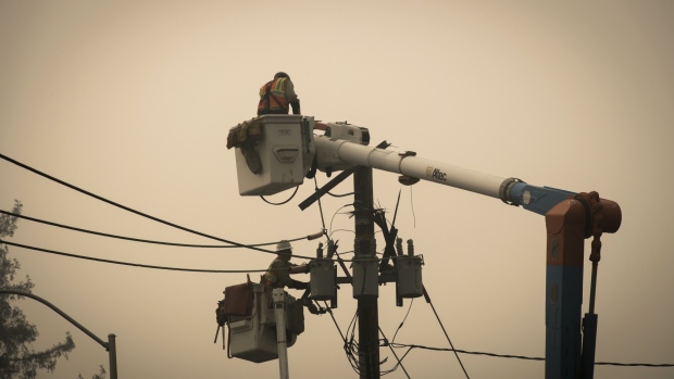 Pacific Gas & Electric Co. (PG&E) workers repair a transformer in Paradise, California, U.S., on Thursday, Nov. 15, 2018.