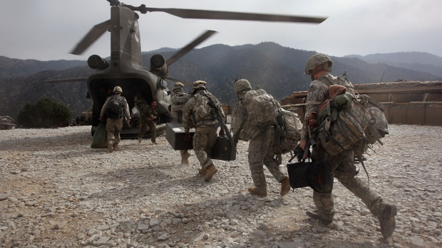 KORENGAL VALLEY, AFGHANISTAN - OCTOBER 27: U.S. soldiers board an Army Chinook transport helicopter after it brought fresh soldiers and supplies to the Korengal Outpost on October 27, 2008 in the Korengal Valley, Afghanistan. The military spends huge effort and money to fly in supplies to soldiers of the 1-26 Infantry based in the Korengal Valley, site of some of the fiercest fighting of the Afghan war. The unpaved road into the remote area is bad and will become more treacherous with the onset of winter. (Photo by John Moore/Getty Images)