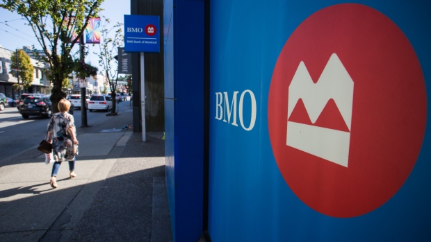 A pedestrian passes in front of a Bank of Montreal branch in Vancouver, British Columbia, Aug. 2017