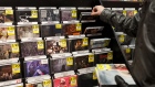 A customer browses CDs inside the HMV Canada Inc. flagship store in Toronto, Ontario, Canada, on Sunday, Jan. 29, 2017. The entertainment retailer HMV Canada Inc. will close all 102 of it's Canadian stores by April 30. 
