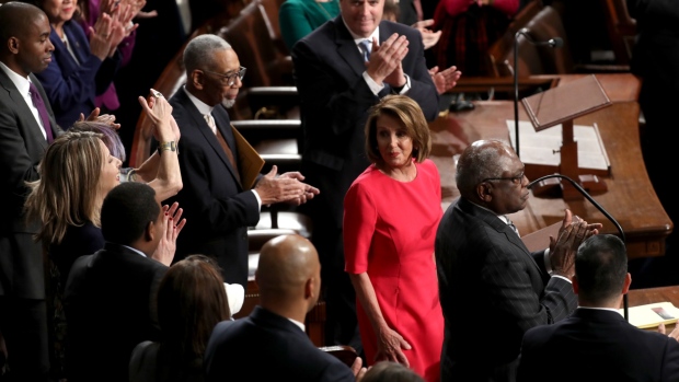 Representatives applaud as U.S. House Speaker Nancy Pelosi, a Democrat from California, center, receives the gavel during a ceremony for the opening of the 116th Congress in the House Chamber in Washington, D.C. on Jan. 3, 2019. 