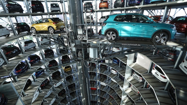 New Volkswagen AG (VW) T-Roc, left, and T-Cross SUVs are guided into storage bays inside one of the automaker's Autostadt delivery towers at the VW headquarters in Wolfsburg, Germany, on Tuesday, Dec. 4, 2018. VW would support eliminating tariffs on exported cars between the European Union and the U.S., the German automaker's strategy head Michael Jost said today at the Handelsblatt auto industry conference. Photographer: Krisztian Bocsi/Bloomberg