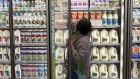 A customer shops for milk during the grand opening of a Whole Foods Market 365 location in Santa Monica, California, U.S., on Wednesday, Aug. 9, 2017. The fifth Whole Foods Market 365 opened on Wednesday, the second location for the Los Angeles area. 