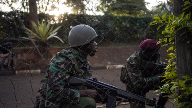 Armed forces take shelter during an attack on Nairobi 