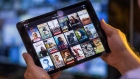 A selection of Netflix Inc. original content sits displayed in the Netflix app on an Apple Inc.  