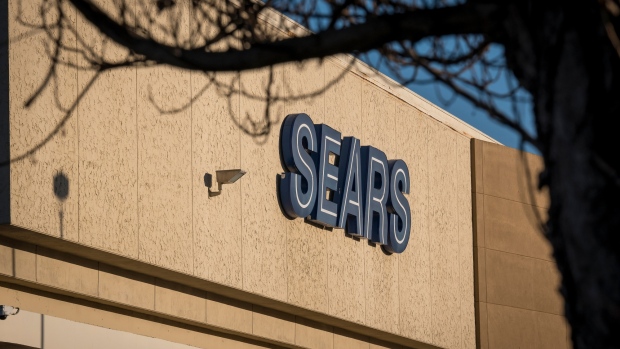 Signage is displayed on the Sears, Roebuck & Co. mail order building, where a Sears Holdings Co. retail store operates on the ground floor, in the Boyle Heights neighborhood of Los Angeles, California, U.S., on Wednesday, Oct. 10, 2018. Sears Holdings Corp., the struggling U.S. chain owned by hedge fund manager Eddie Lampert, is preparing for a bankruptcy filing as soon as Sunday, according to a person familiar with the plan. 