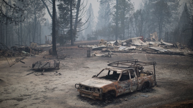 SAN ANDREAS, CA - SEPTEMBER 13: A burned truck and structures are seen at the Butte Fire on September 13, 2015 near San Andreas, California. California governor Jerry Brown has declared a state of emergency in Amador and Calaveras counties where the 100-square-mile wildfire has burned scores of structures so far and is threatening 6,400 in the historic Gold Country of the Sierra Nevada foothills. (Photo by David McNew/Getty Images)