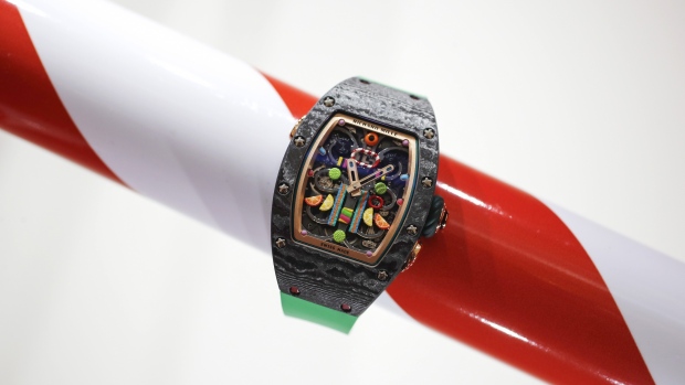 An RM 37-01 Automatic Kiwi watch from the 'Bonbon' collection stands on display on the Richard Mille stand during the Salon International de la Haute Horlogerie (SIHH) in Geneva, Switzerland, on Tuesday, Jan. 15, 2019. The elephant in the room at this week’s Swiss watch fair in Geneva is that the industry is still struggling to find buyers for all the timepieces it has produced over the years. Photographer: Stefan Wermuth/Bloomberg