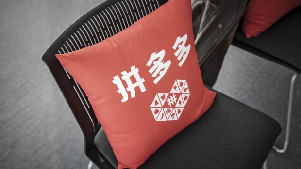 The Pinduoduo logo is seen on a cushion at the company's office in Shanghai, China, on Friday, Feb. 24, 2017. Pinduoduo, or PDD, is a kind of Facebook-Groupon mashup that Huang believes could revolutionize e-commerce. 