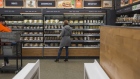 An Amazon.com Inc. employee shops for prepared food at the Amazon Go store in Seattle. 