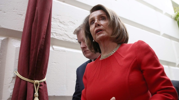 WASHINGTON, DC - JANUARY 23: U.S. Speaker of the House Nancy Pelosi (L) departs a meeting of the House Democratic caucus at the U.S. Capitol on January 23, 2019 in Washington, DC. U.S. President Donald Trump and congressional Democrats remain deadlocked in their positions regarding the partial shutdown of the federal government. (Photo by Win McNamee/Getty Images) 