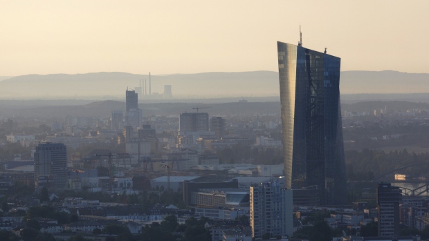 The European Central Bank (ECB) skyscraper headquarters building stands above commercial and residential property at dawn in Frankfurt, Germany, on Wednesday, July 25, 2018. The ECB president and his colleagues will set policy on Thursday, with analysts predicting the Governing Council will reaffirm that bond purchases will end in December and interest rates could start rising after the summer of 2019. 