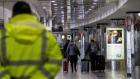 Travelers pull luggage at LaGuardia Airport in New York. 