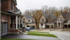 Homes for sale stand in East Gwillimbury, Ontario, Canada, on Friday, Nov. 2, 2018. STCA Canada is scheduled to release new housing price figures on Dec. 13. Photographer: Cole Burston/Bloomberg