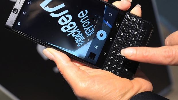 An attendee uses the camera on a Blackberry Keyone smartphone at the IFA Consumer electronics show in Berlin, Germany, on Friday, Sept. 1, 2017. The IFA features 1,805 exhibitors from the global technology industry and runs to September 6. 