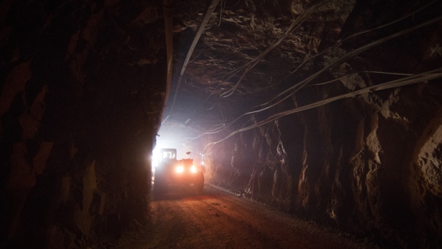 A truck moves through a tunnel to pick up rock ore from the digging floor at the Yalea underground gold mine, part of the Loulo-Gounkoto gold mine complex operated by Randgold Resources Ltd., in Loulo, Mali, on Thursday, Oct. 31, 2013. 
