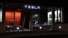 Electrc vehicles stands on display inside a Tesla Inc. store in Bern, Switzerland. 