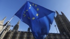 A European Union (EU) flag flies during ongoing pro and anti Brexit protests outside the Houses of Parliament in London, U.K., on Tuesday, Jan. 22, 2019. The U.K.’s main opposition party is backing a plan that could open the door to a second European Union referendum, bringing the possibility of stopping Brexit a step closer. 