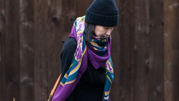 Meng Wanzhou leaves her home under the supervision of security in Vancouver on Dec. 12, 2018. Photographer: Ben Nelms/Bloomberg