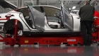 Tesla Motor Inc. associates work on the Model S electric car at the company's factory in Fremont, California, U.S.