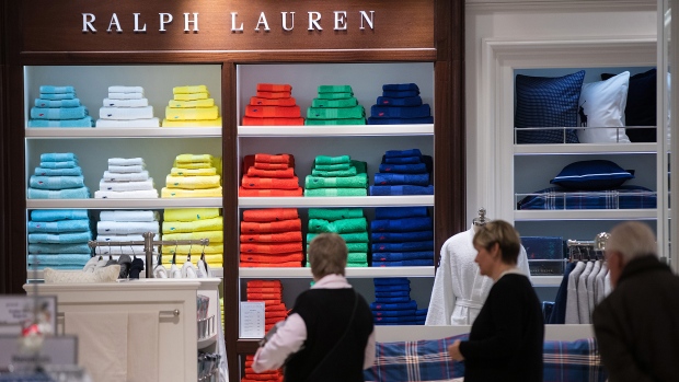 A selection of Ralph Lauren Corp. bath towels sit stacked on display stands inside a Galeria Kaufhof