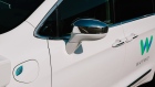 The side mirror of a Waymo LLC Chrysler Pacifica autonomous vehicle 