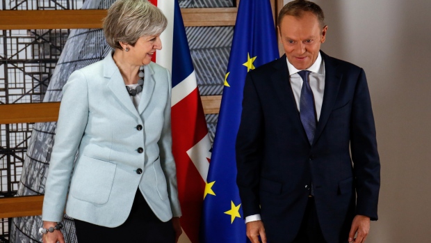 Theresa May, U.K. prime minister, left, and Donald Tusk, president of the European Union (EU). 