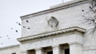 Birds fly past the Marriner S. Eccles Federal Reserve Board building in Washington, D.C., U.S.