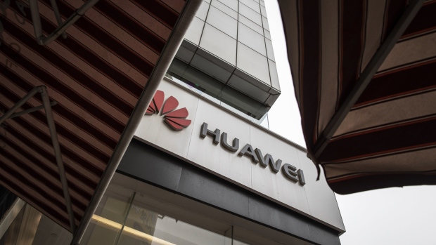 The Huawei Technologies Co. logo is displayed outside a store in Shanghai, China, on Tuesday, Jan. 29, 2019. U.S. prosecutors filed criminal charges against Huawei, China's largest technology company, alleging it stole trade secrets from an American rival and committed bank fraud by violating sanctions against doing business with Iran. Huawei has denied committing the alleged charges. 