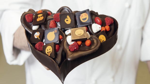 Torres tops the chocolate hearts with nuts and candy. Photographer: Gabriela Herman/Bloomberg