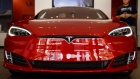 A Tesla Inc. Model S electric vehicle is displayed at the company's showroom in Newport Beach, California, U.S., on Friday, July 6, 2018. Tesla Inc. reached a milestone critical to Elon Musk's goal to bring electric cars to the masses -- and earn some profit in the process -- by finally exceeding a long-sought production target with the Model 3. 